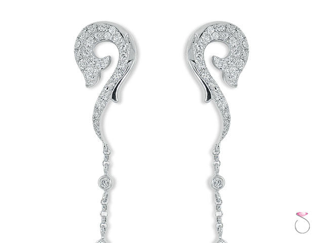 Dolphin dangle earrings in diamonds and 18K - top closeup