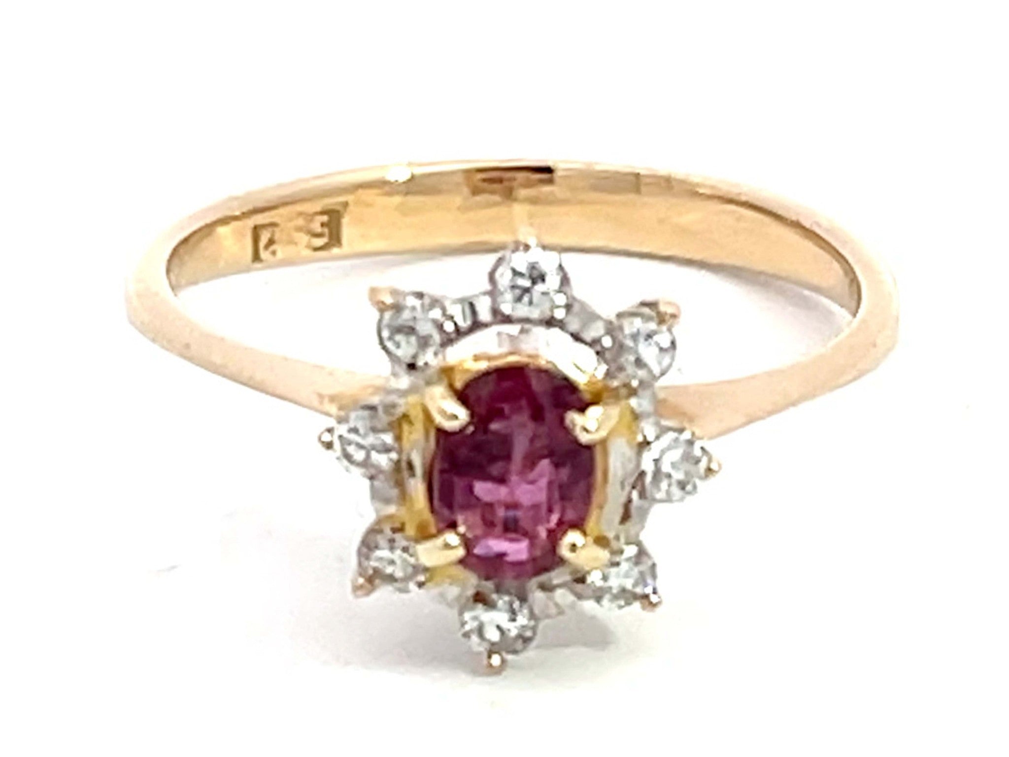 Oval Ruby and Diamond Halo Ring in 14k Yellow Gold