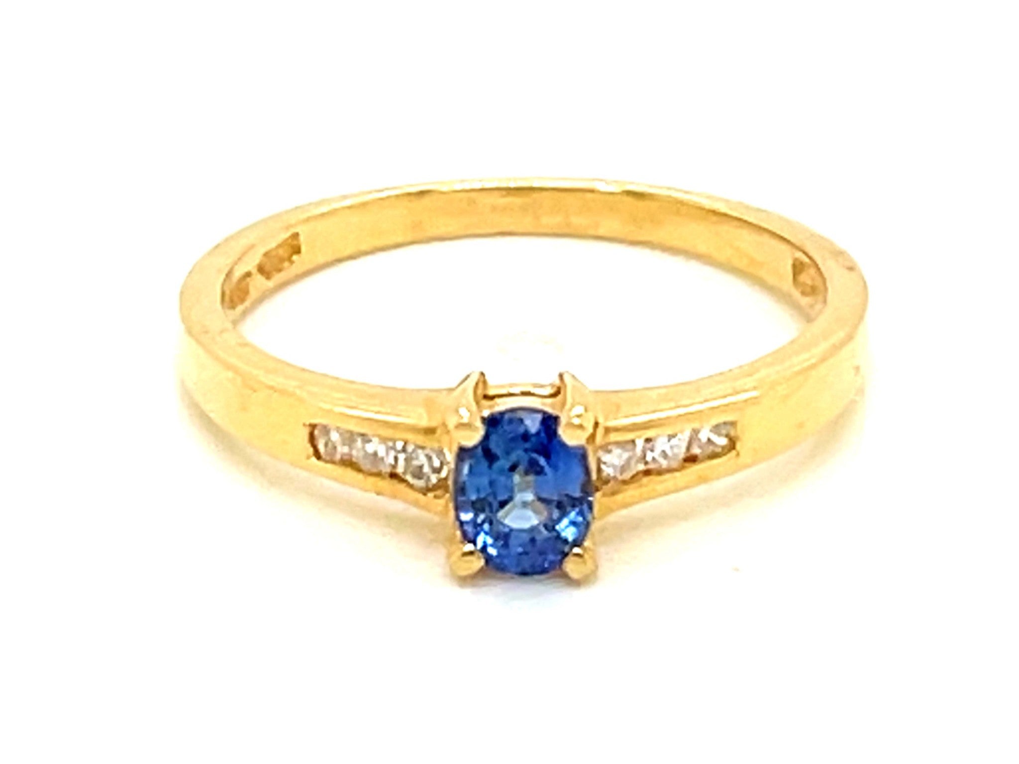 Light Vibrant Blue Sapphire Channel Set Diamond Ring in 14k Yellow Gold